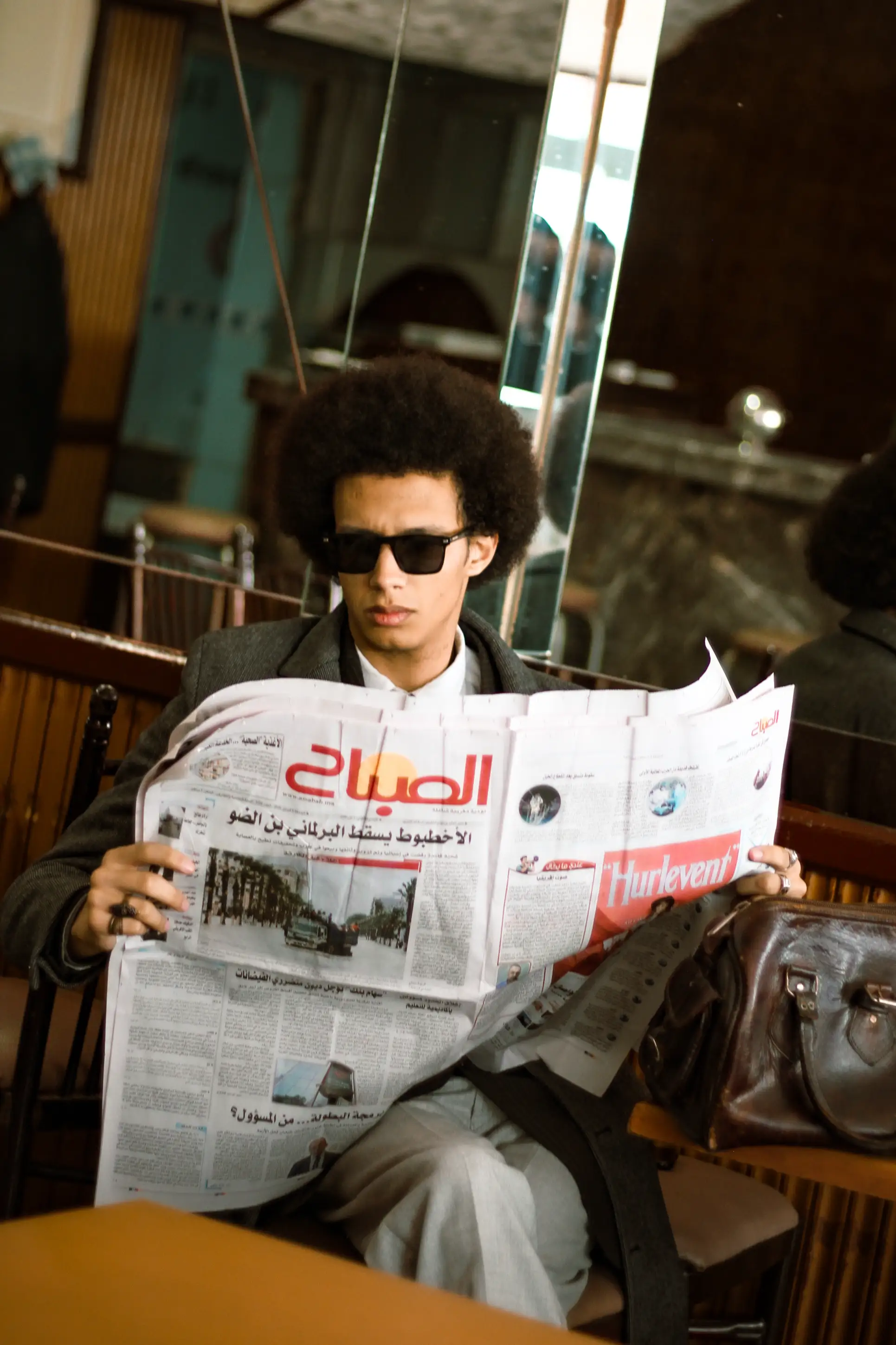 AFTER HOURS NOIR - newspaper fashion pose photography by Driss Nassiri