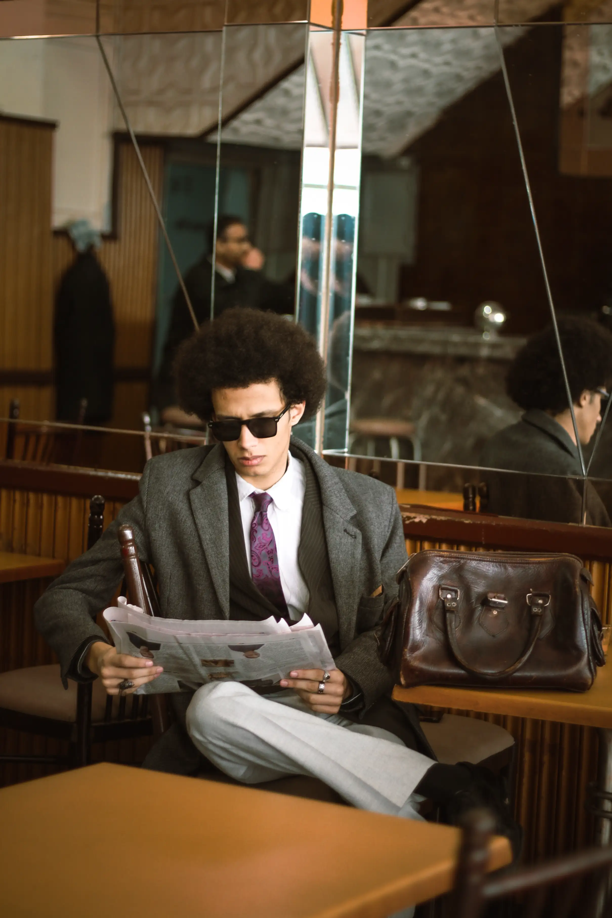 AFTER HOURS NOIR - reading newspaper shot photography by Driss Nassiri