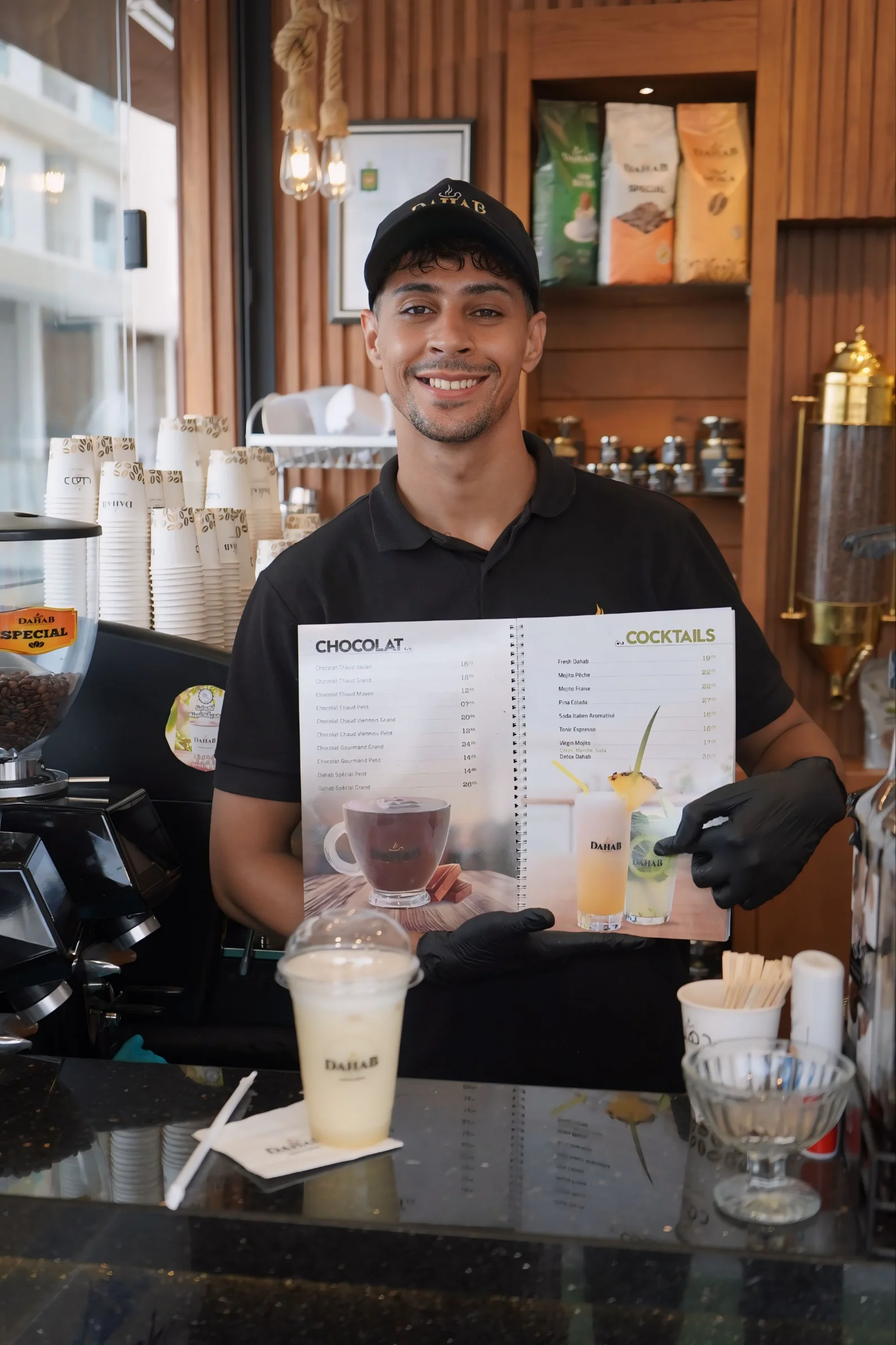 DAHAB CASABLANCA CAMPAIGN - barista holding menu photography by Driss Nassiri