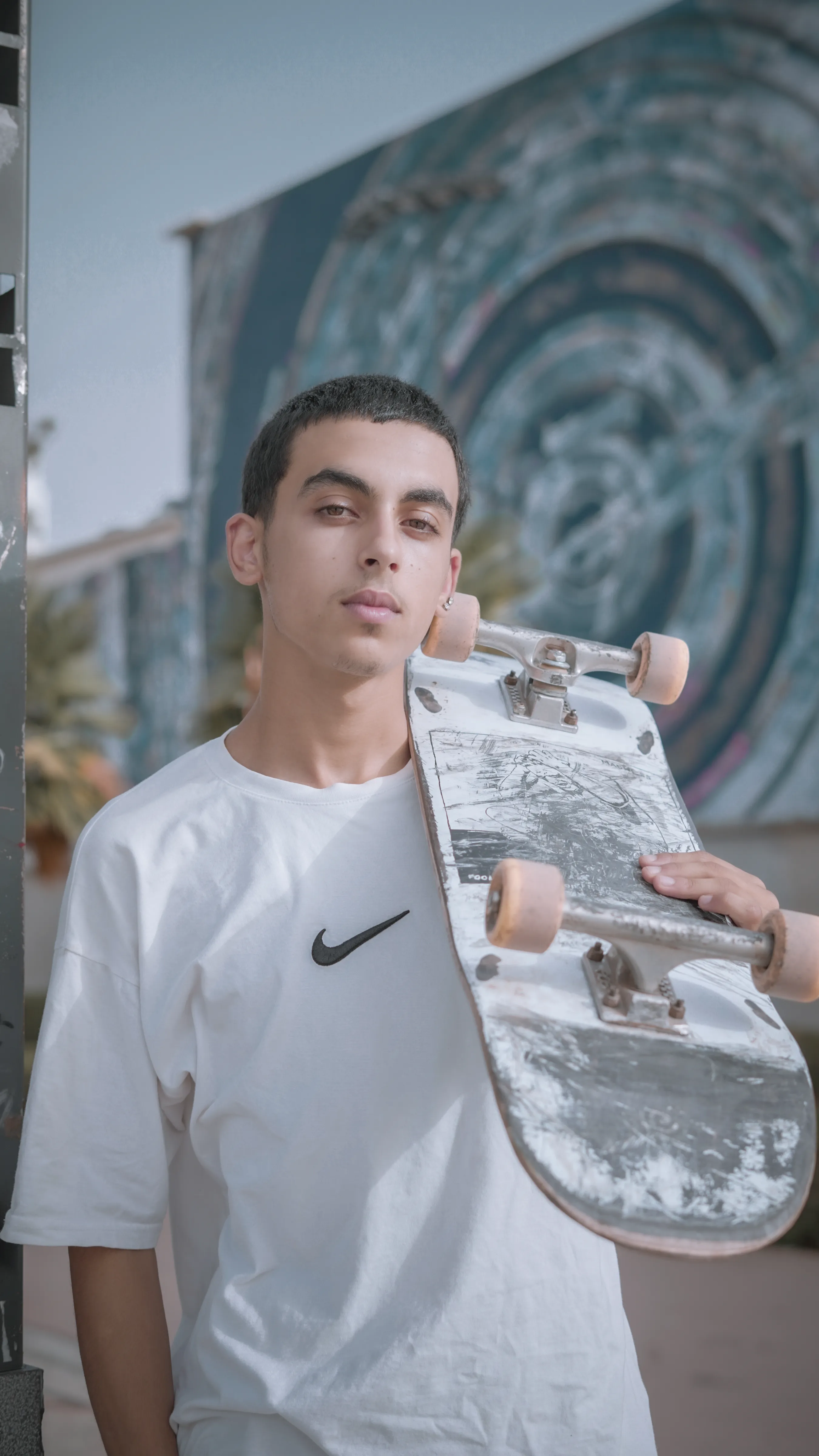NEVADA - holding skateboard portrait photography by Driss Nassiri