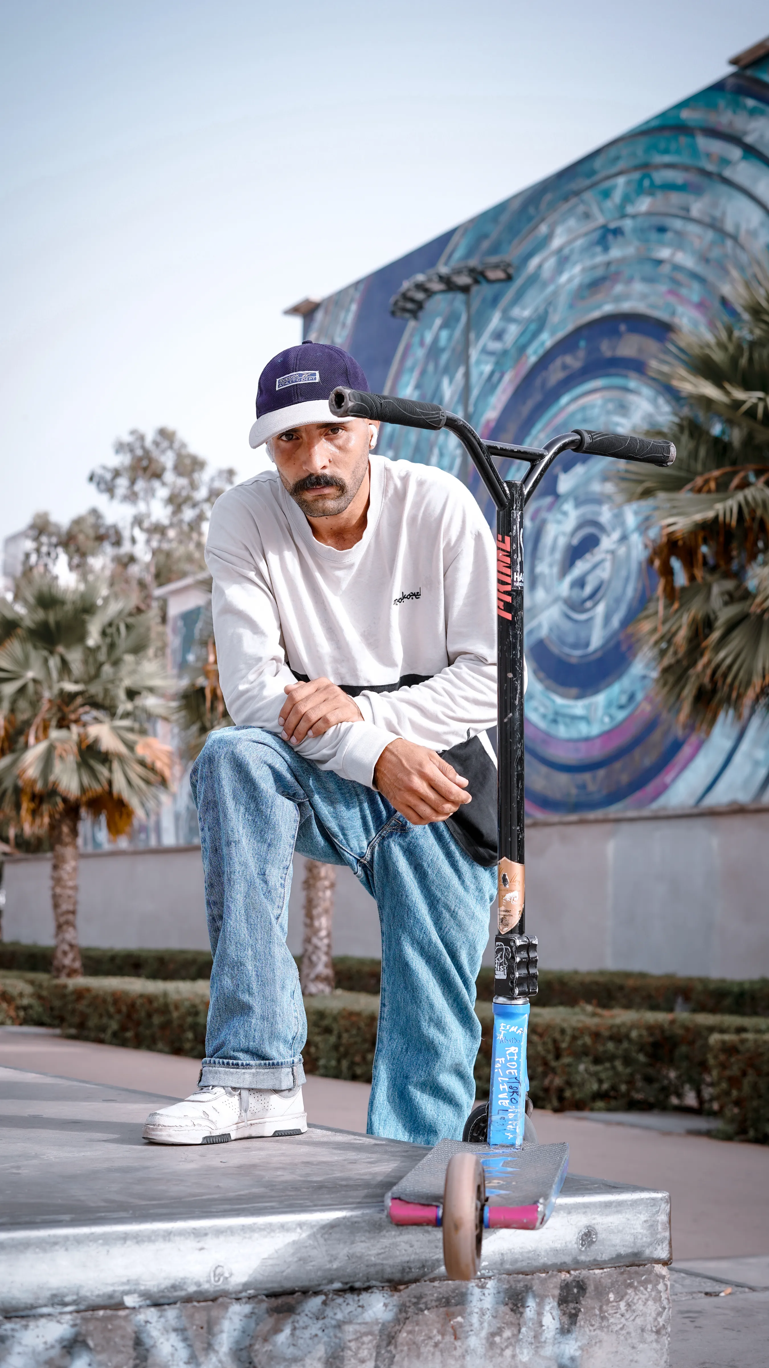NEVADA - scooter rider kneeling photography by Driss Nassiri